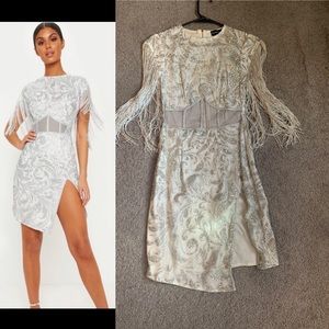 White & Silver dress with silver tassels.